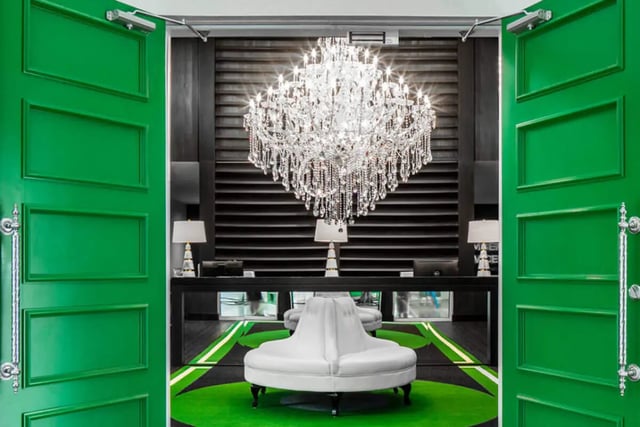 White curved bench chandelier modern reception area at The Ivy in Tampa Student Accommodation