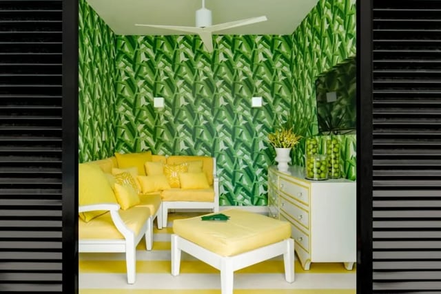 Yellow sofa, ottoman, dresser, TV, living room at The Ivy in Tampa Student Accommodation