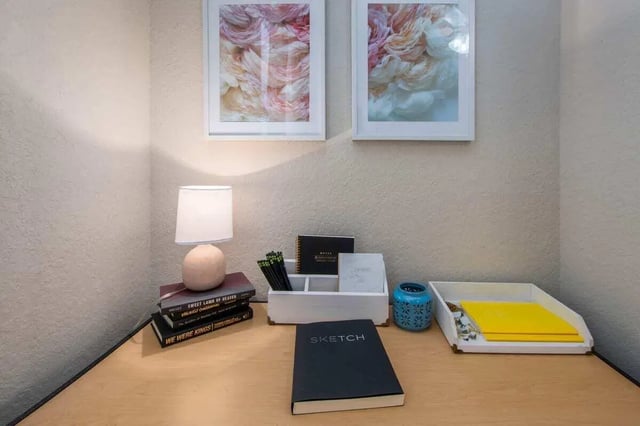 Desk with books lamp and artwork Study area at The Ivy in Tampa Student Accommodation