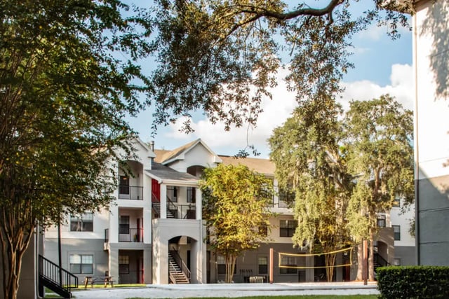 Apartment buildings with volleyball court exterior at The Ivy in Tampa Student Accommodation
