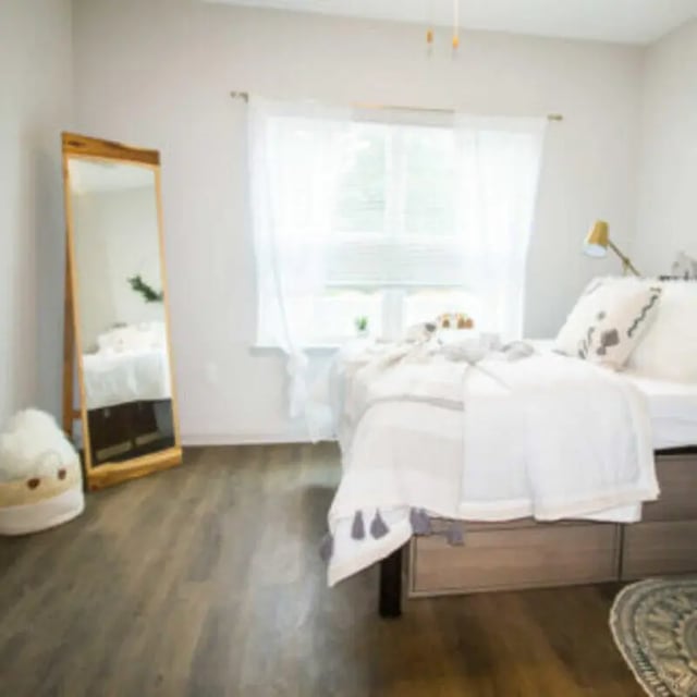 Bed mirror and white bedding bedroom at Bellamy Florence in Florence Student Accommodation