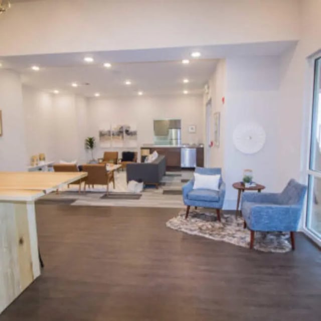 Modern lounge area with couches and chairs living room at Bellamy Florence in Florence Student Accommodation