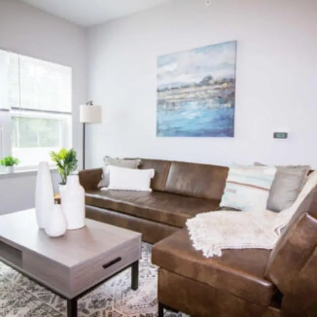 Leather couch coffee table and artwork living room at Bellamy Florence in Florence Student Accommodation