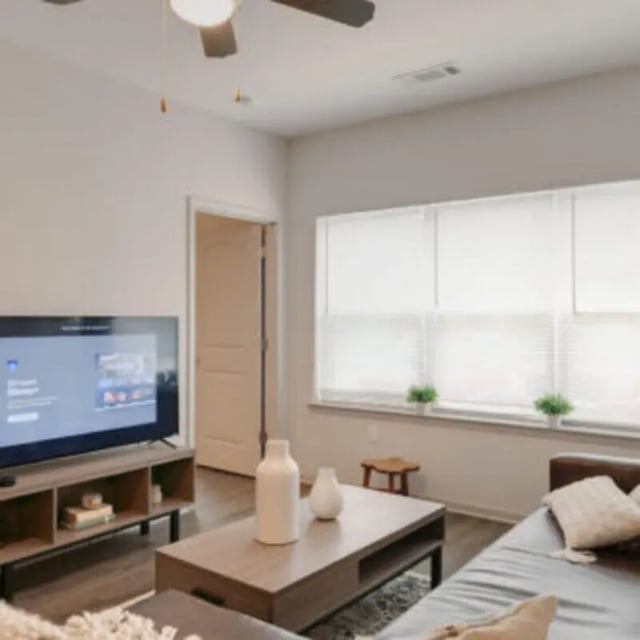 TV on stand and coffee table living room at Bellamy Florence in Florence Student Accommodation