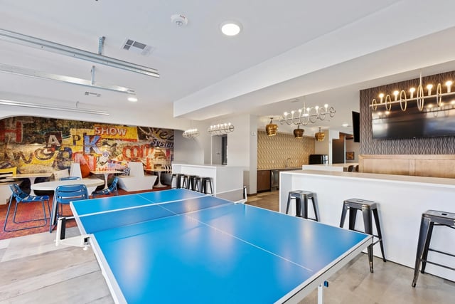 Ping pong table with seating and bar area playing area at Canyon Flats in Reno Student Accommodation