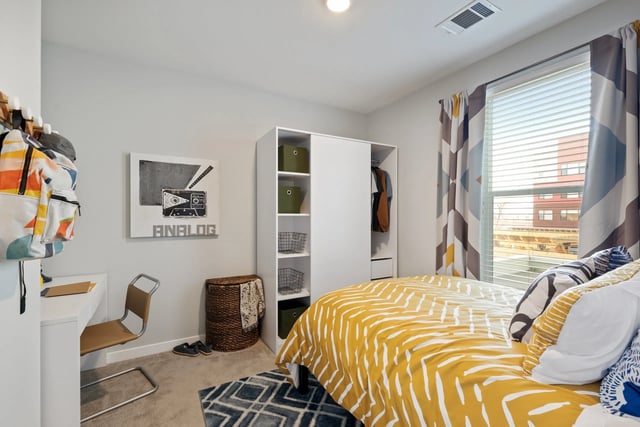Bed desk closet and artwork bedroom at Canyon Flats in Reno Student Accommodation