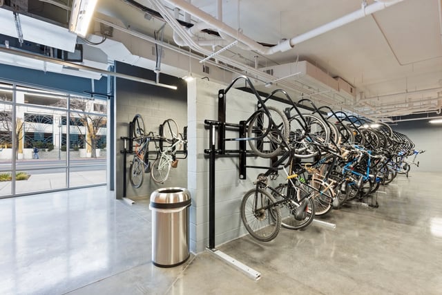 Bikes on racks and trash can storage area at Canyon Flats in Reno Student Accommodation