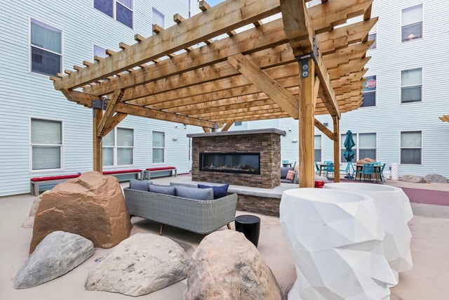 Sofa fireplace and rocks exterior at Canyon Flats in Reno Student Accommodation