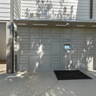 Grey package lockers with screen exterior at Bellamy Milledgeville in Milledgeville Student Accommodation