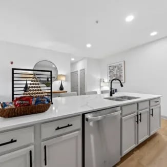 Island with sink dishwasher and snacks kitchen at Bellamy Milledgeville in Milledgeville Student Accommodation