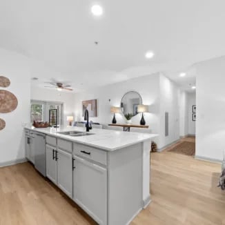 Modern kitchen island with sink and cabinets kitchen at Bellamy Milledgeville in Milledgeville Student Accommodation