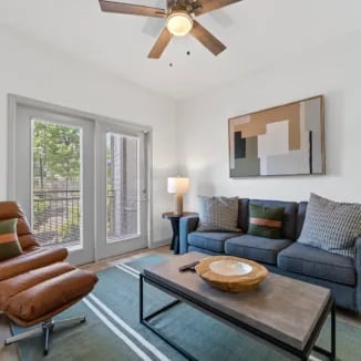 Living room with sofa chair coffee table living room at Bellamy Milledgeville in Milledgeville Student Accommodation