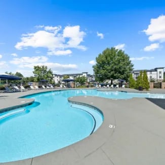 Resort style pool with lounge chairs outdoor area exterior at Bellamy Milledgeville in Milledgeville Student Accommodation