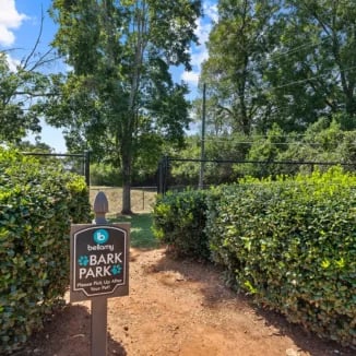 Bark Park sign surrounded by bushes exterior at Bellamy Milledgeville in Milledgeville Student Accommodation