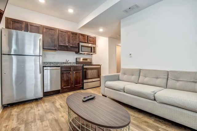 Kitchen appliances sofa and coffee table living room at 61 Vandy in Charleston Student Accommodation