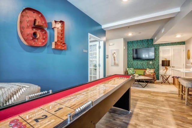 Shuffleboard table with lounge area playing area at 61 Vandy in Charleston Student Accommodation