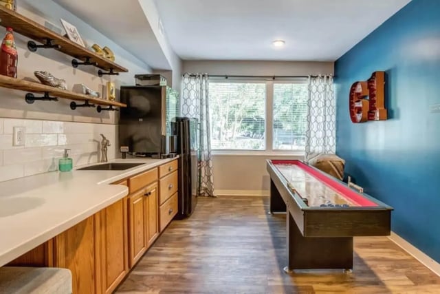 Shuffleboard table bar area game room at 61 Vandy in Charleston Student Accommodation