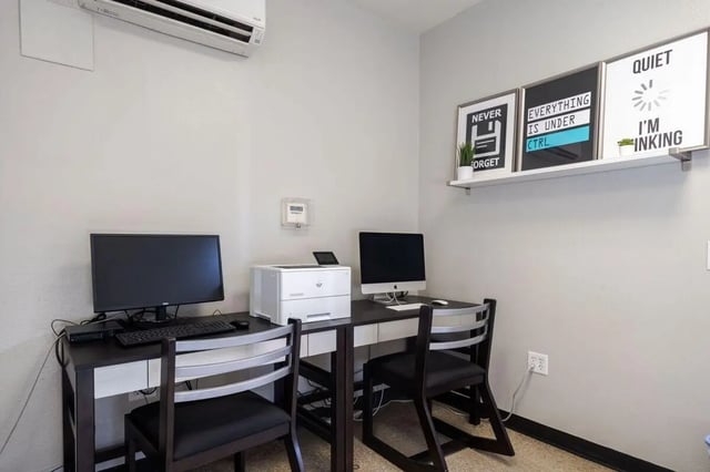 Two computers printer and chairs study area at Claremont Collegiate Apartments