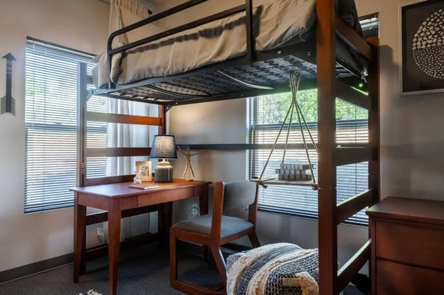 Loft bed desk chair lamp decor study area bedroom at Claremont Collegiate Apartments