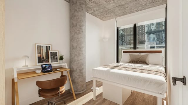 Desk bed and city view bedroom at 626 on the Park in Chicago Student Accommodation