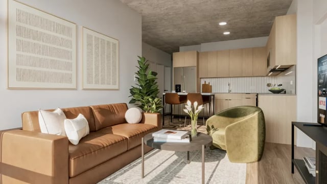 Brown sofa coffee table artworks plant kitchen living room at 626 on the Park in Chicago Student Accommodation