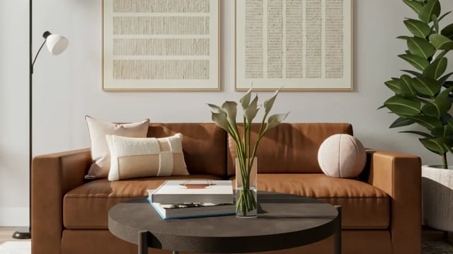 Brown couch with pillows artwork plants living room at 626 on the Park in Chicago Student Accommodation