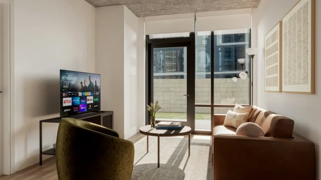 Sofa chair TV table artwork and coffee table living room at 626 on the Park in Chicago Student Accommodation