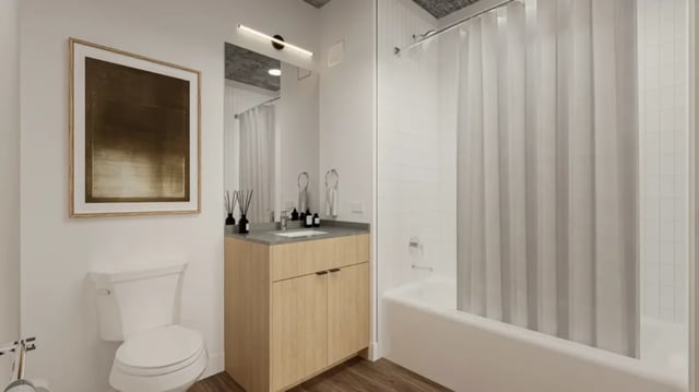 Toilet vanity sink and bathtub with shower curtain bathroom at 626 on the Park in Chicago Student Accommodation