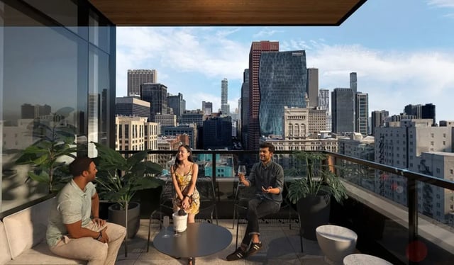Balcony with people overlooking city skyline balcony living area at 626 on the Park in Chicago Student Accommodation
