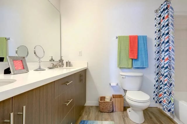 Toilet towels shower curtain sink and vanity bathroom at The U Apartments in Davis Student Accommodation