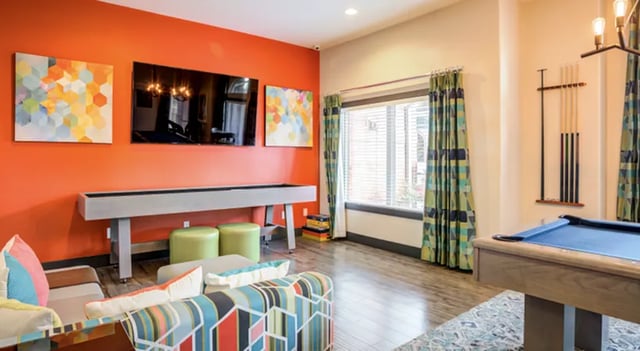 Shuffleboard pool table and lounge area living room at The U Apartments in Davis Student Accommodation