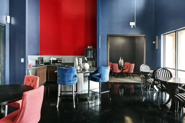 Kitchen with bar stools and dining area lounge at Crimson in Tuscaloosa Student Accommodation