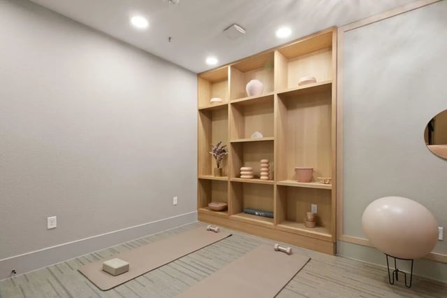 Yoga mats with weights wooden shelving room at UNITi Bishop Arts in Dallas Student Accommodation