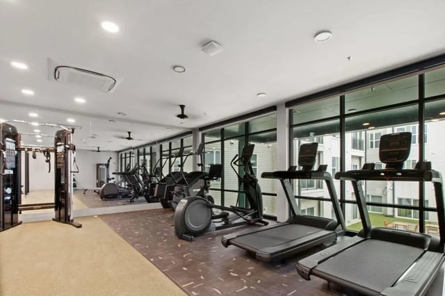 Treadmills ellipticals weight machine mirrors gym at UNITi Bishop Arts in Dallas Student Accommodation