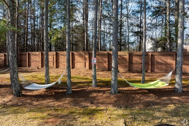 Hammocks strung between pine trees exterior at Clemson Edge in Clemson Student Accommodation