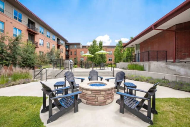 Adirondack chairs around fire pit patio exterior at The Province Boulder in Boulder Student Accommodation