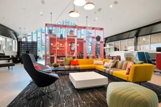 Modern lounge with colorful sofa and chairs living room at The Province Boulder in Boulder Student Accommodation