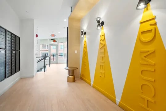 Mailboxes and yellow wall art hallway at The Province Boulder in Boulder Student Accommodation
