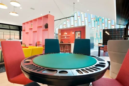 Gaming table with chairs communal space at The Province Boulder in Boulder Student Accommodation