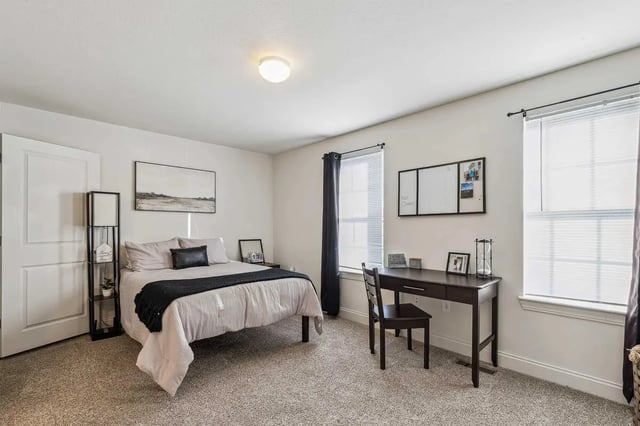 Bed desk with whiteboard and artwork Bedroom at Copper Beech at Ames Apartments in Ames Student Accommodation