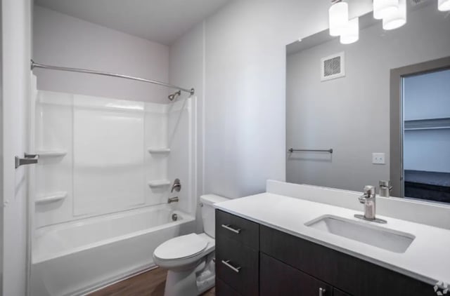 Modern bathroom with vanity toilet and bathtub at The Davy in Knoxville Student Accommodation