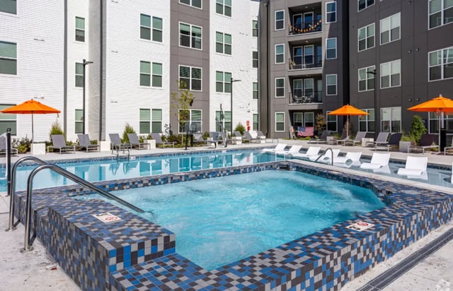 Pool and hot tub with lounge chairs exterior at The Davy in Knoxville Student Accommodation