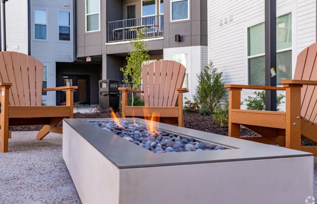 Adirondack chairs around fire pit exterior at The Davy in Knoxville Student Accommodation