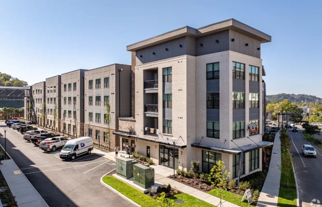 Apartment building with parking lot and street exterior at The Davy in Knoxville Student Accommodation