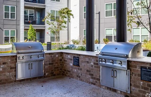 Two stainless steel grills on brick outdoor area at The Davy in Knoxville Student Accommodation