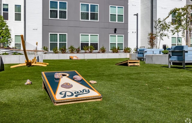 Hammock and cornhole game area exterior at The Davy in Knoxville Student Accommodation