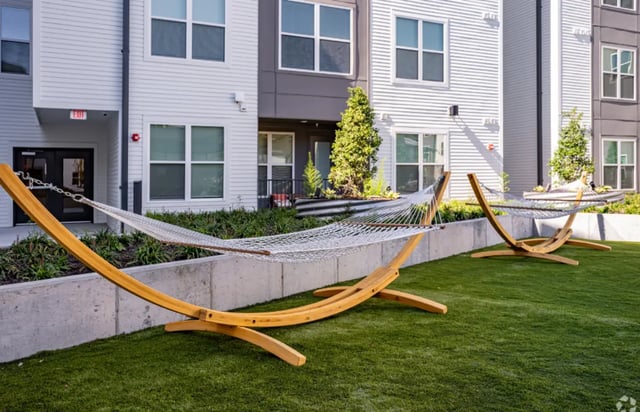 Two hammocks on green grass outdoor area exterior at The Davy in Knoxville Student Accommodation