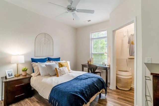 Bed nightstand desk and closet bedroom at The Province Greensboro in Greensboro Student Accommodation
