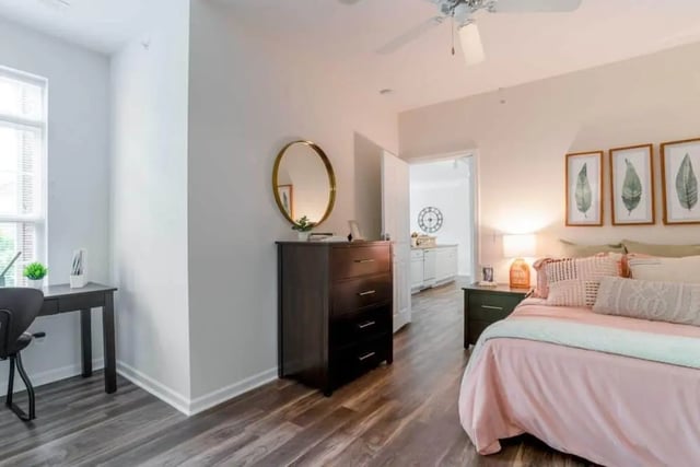 Desk chair dresser mirror bed kitchen area bedroom at The Province Greensboro in Greensboro Student Accommodation