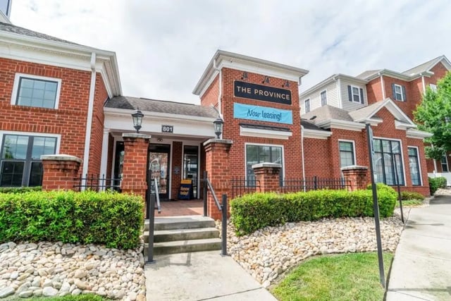 Brick building with "The Province" sign exterior at The Province Greensboro in Greensboro Student Accommodation